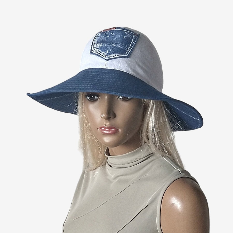 A three-quarter view of a wide-brim blue and white denim summer hat