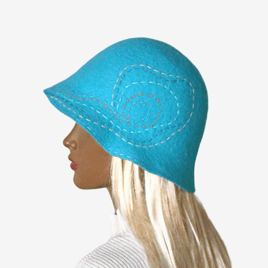 A turquoise winter felted cloche hat with a small brim