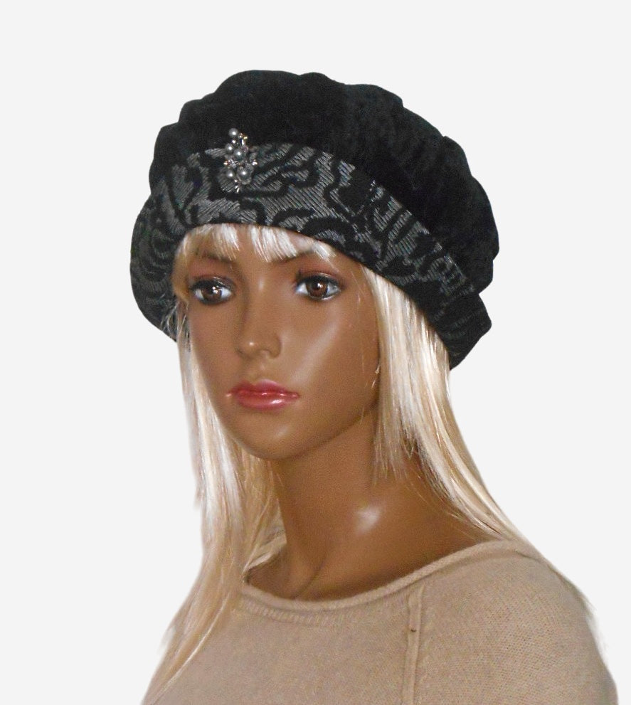 Black velvet brimmed beret hat, front view, elegant winter accessory