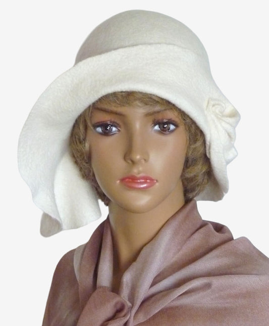 Front view of white felt merino wool hat with asymmetrical brim