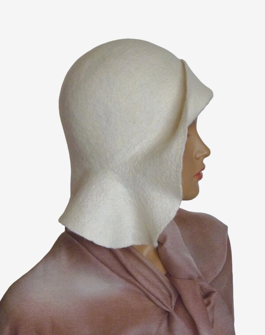 Side view showing the draped detail on one side of the white felt hat
