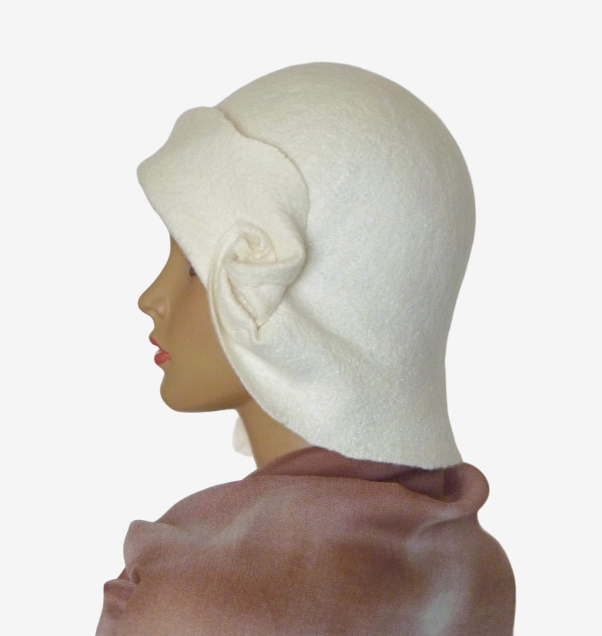 Side view showing the draped detail on one side of the white felt hat