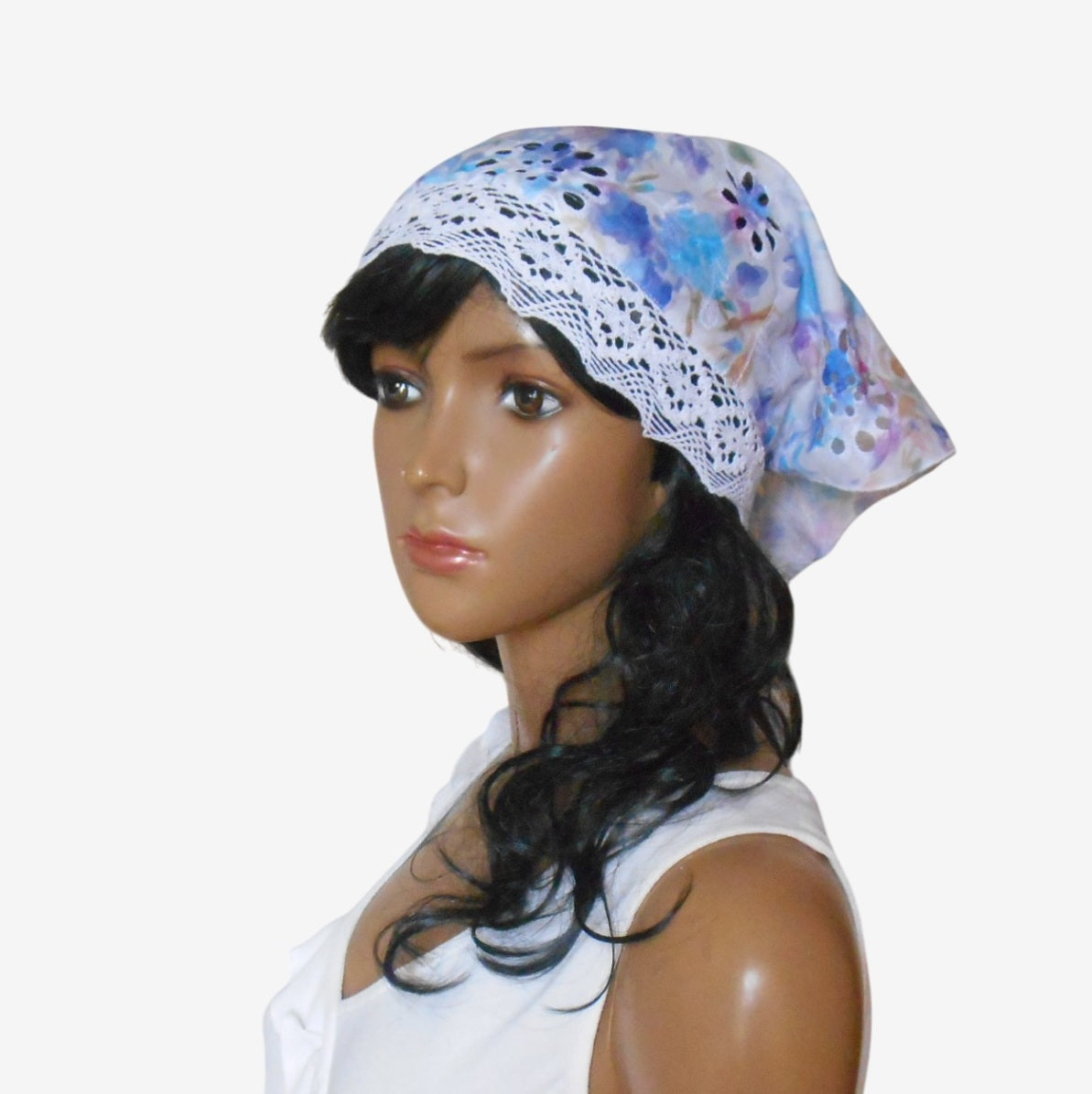 Three-quarter left view of elegant women’s triangular sun scarf showing delicate white lace ties