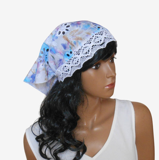 Three-quarter right view of elegant triangular sun scarf highlighting lace tie details and versatile summer style
