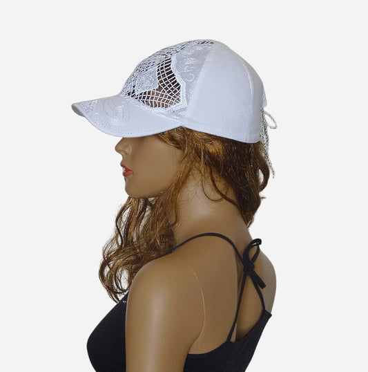 Side view of a white summer baseball cap with adjustable lace closure