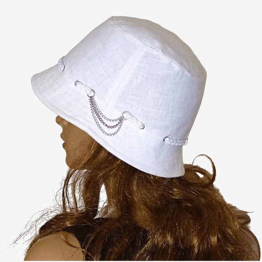 White linen summer hat with narrow brim and chain accents