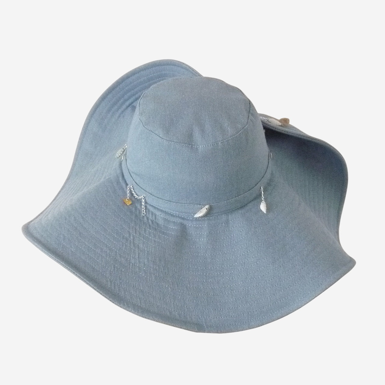 Wide-brim denim hat with shells and chains, back view