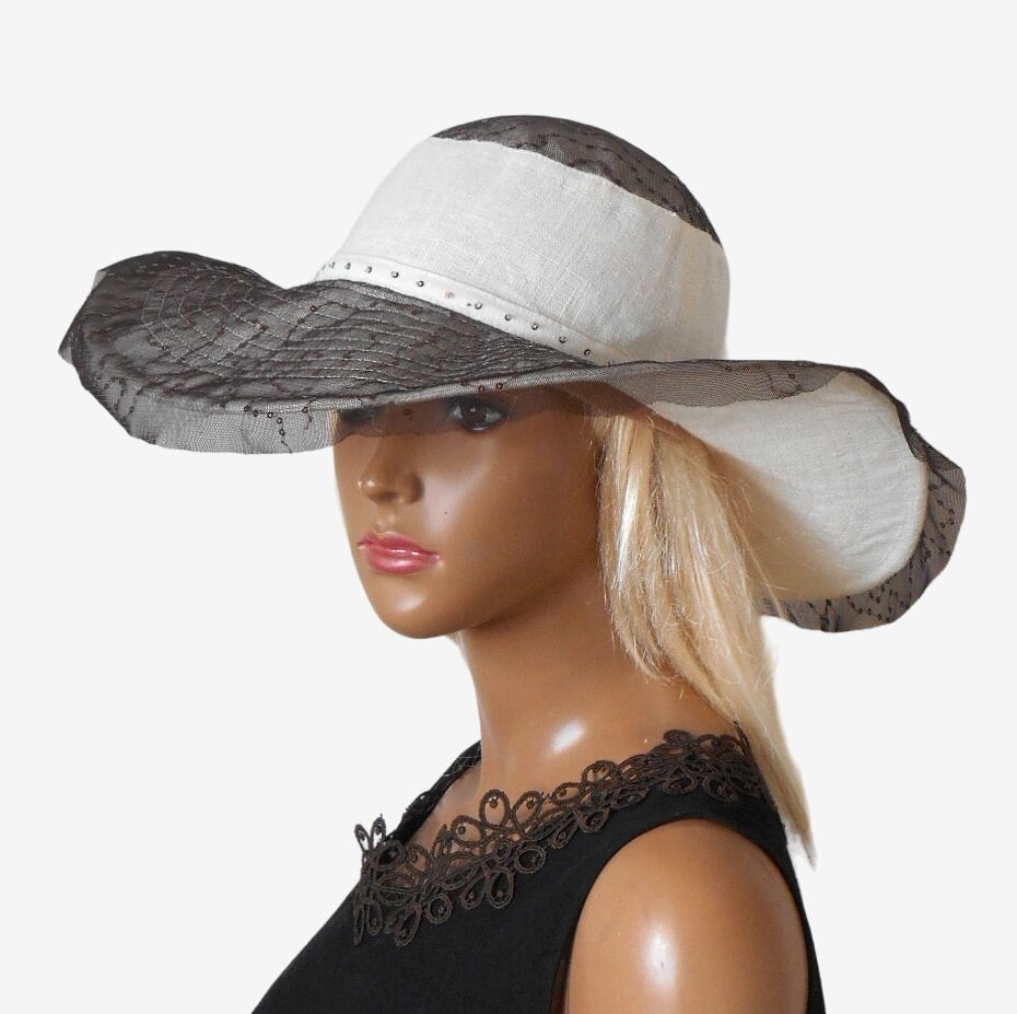 Three quarter view of women’s wide-brim sun hat highlighting style and design