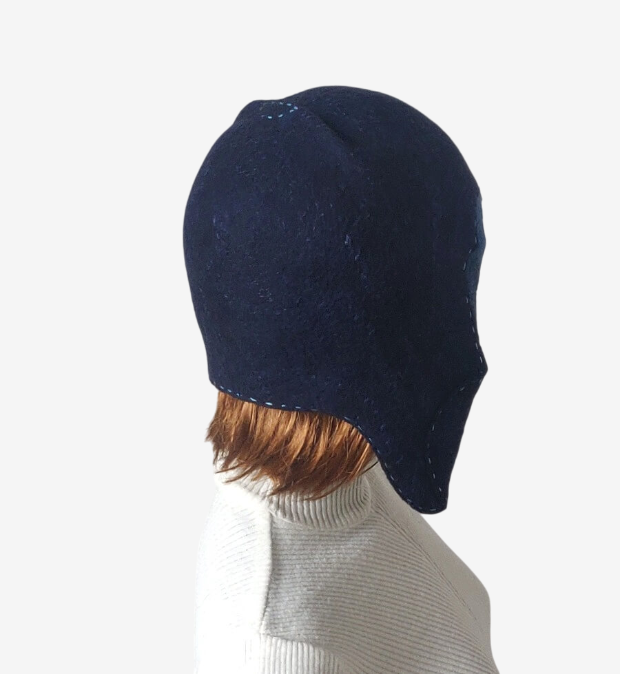 Back view of the winter hat showing adjustable fit and cozy design.