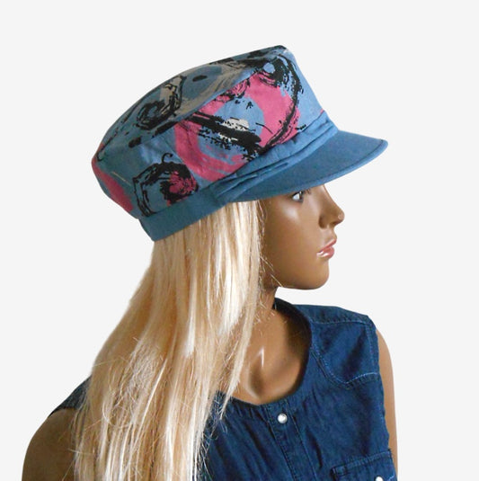 Side view of women’s lightweight denim captain’s cap with stylish drapery