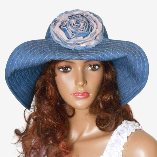 Front view of handmade women’s denim hat with sewn-on floral accent