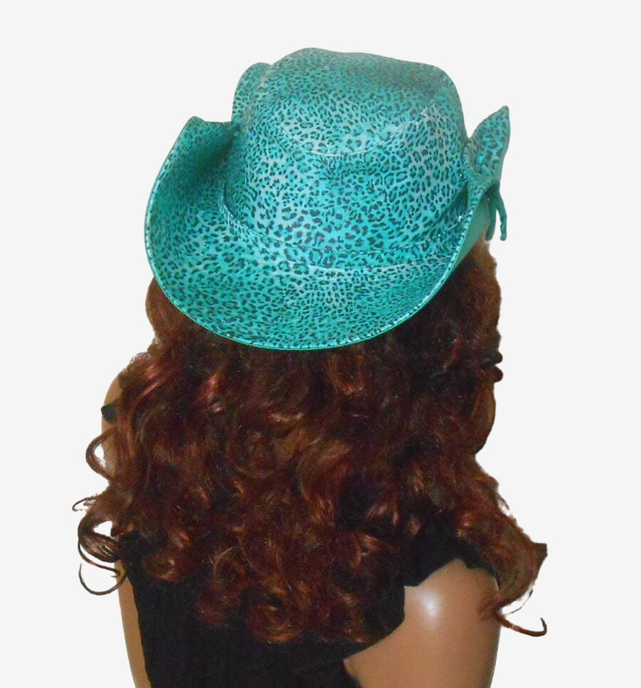 Back view of women’s green cowboy hat