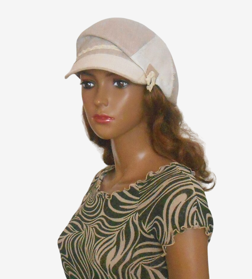 Womens beige linen newsboy cap front view with visor and button accent