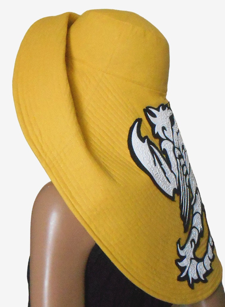 Yellow asymmetrical brim hat, side view
