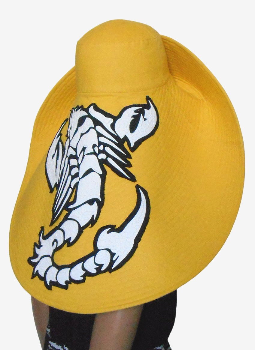 Back view of yellow wide brim linen hat, asymmetrical design, summer sun hat with scorpion applique