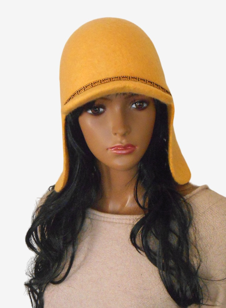 Yellow felt trapper hat with ear flaps, front view