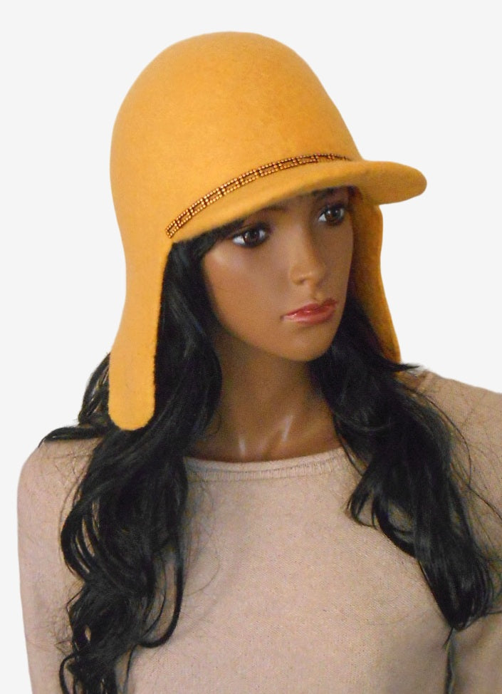 Yellow felt trapper hat with ear flaps, three-quarter view