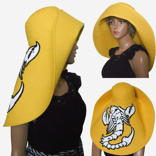 A yellow wide-brimmed linen hat with a scorpion applique, displayed from different angles.